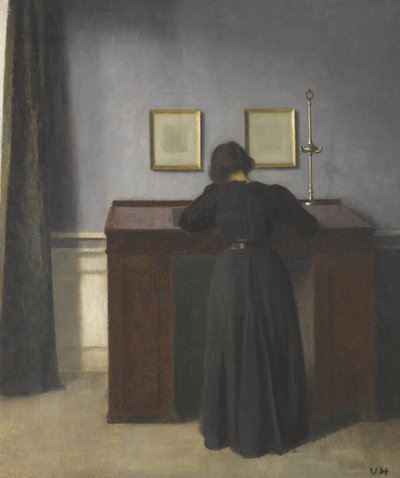 Ida in piedi a una scrivania da Vilhelm Hammershøi