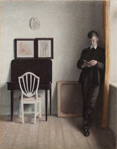 Interno con un giovane che legge da Vilhelm Hammershoi