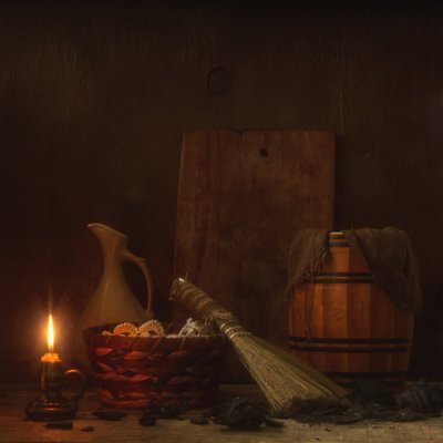 Natura morta rustica con candele da magnola