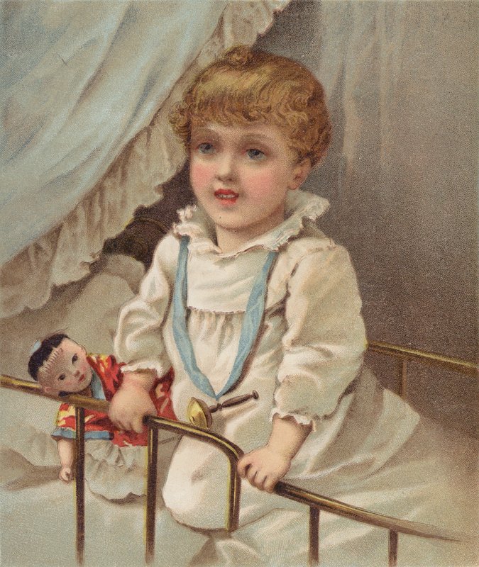 Bambino piccolo in una culla da English School