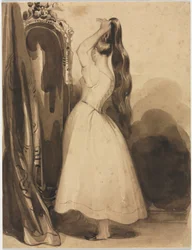 Giovane donna che si pettina