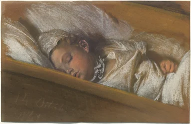 Un bambino che dorme nella sua culla