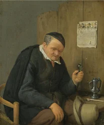 Un uomo anziano con un bicchiere di vino in mano