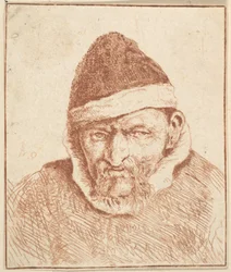 Anziano con colletto bianco e cappello a punta