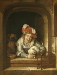 Due bambini che giocano con un gatto con un uccello tra le fauci