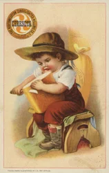 Ragazzo che affetta una pagnotta di pane