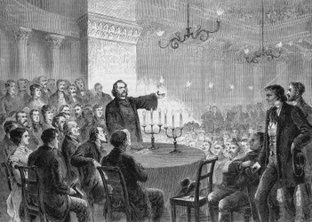 Conferenza del riformatore Johannes (Jean) Ronge (1813-1887) a Vienna nel 1868. Fondò la Chiesa Cristiana Universale. Incisione del 1868. Collezione privata