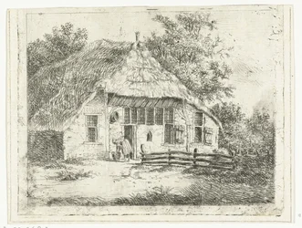 Donna china su un cesto davanti a una casa a Staphorst