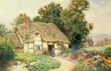 Un cottage presso uno stagno di anatre