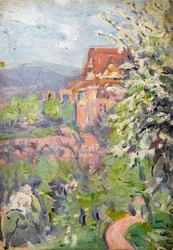 Casa con albero in fiore in primo piano