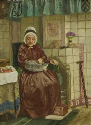 Donna anziana vicino al caminetto