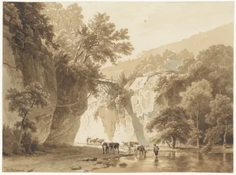 Paesaggio roccioso con mucche che bevono