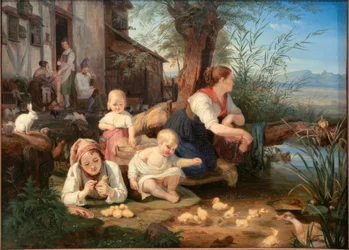 Madre con bambini allo stagno del villaggio