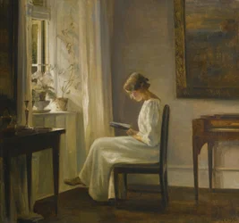 Interno con una donna che legge