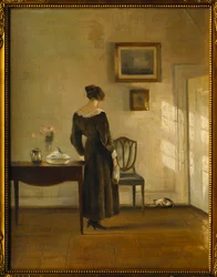 Un Interno con una Donna che Nutre un Gatto