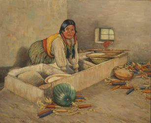 Donna Hopi che macina il mais