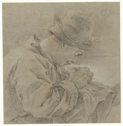 Disegnatore al lavoro, visto di lato