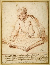 Padre Sebastiano Resta esamina un foglio di disegni