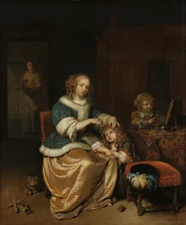 Interno con una madre che pettina i capelli del suo bambino, noto come 