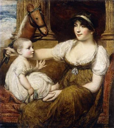 Una madre che tiene un cavalluccio, giocando con il suo bambino