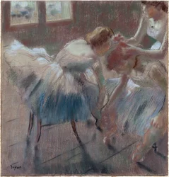 Tre ballerine che si preparano per la lezione