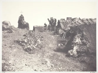 Chaumières en Auvergne, con un calvario