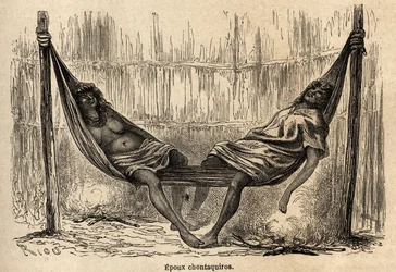 Mariti indiani Chontaquiros del Perù che dormono nella loro amaca nuziale