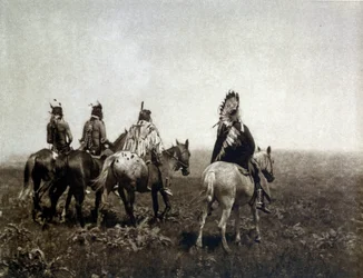 Guerriero indiano (gli Apsaroke) che cavalca nella pianura