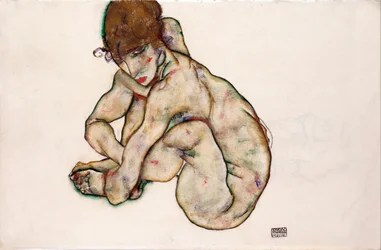 Ragazza nuda accovacciata