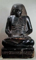 Amenhotep, figlio di Hapu, seduto a gambe incrociate, dal Tempio di Amon, Karnak, c.1391-53 a.C. (granito)