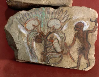 Ostrakon che raffigura una scimmia che raccoglie datteri osservata da un giovane uomo dall