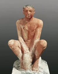 Civiltà egizia, statua in calcare dipinto raffigurante un uomo che modella l