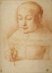 Giovane donna che scrive o disegna