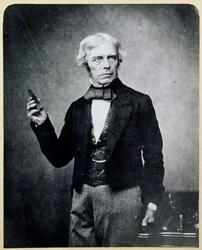 Michael Faraday (1791-1867) con un magnete a barra, di Maull e Polyblank