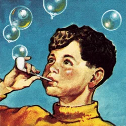 Ragazzo che soffia bolle da una pipa