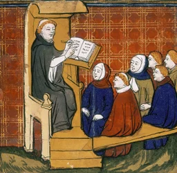 Insegnante domenicano, seduto con un libro su un leggio, con alunni seduti a terra davanti a lui. "Livre des Proprietez des Choses", inizio XV secolo