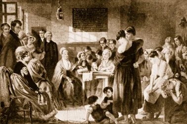 Elizabeth Fry legge la Bibbia in una prigione