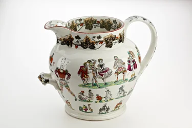 Brocca Staffordshire decorata con figure di Arlecchino e tema carnevalesco, 1866