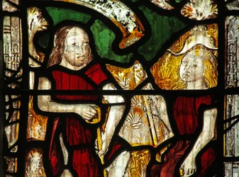 Vetrata s1 raffigurante Adamo scava mentre Eva fila