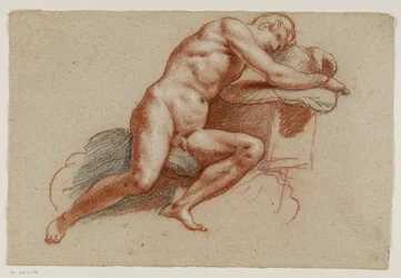 Nudo maschile appoggiato su un cuscino