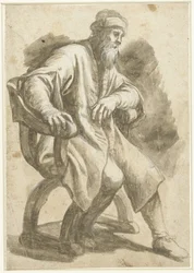 Uomo seduto in poltrona