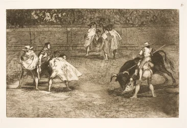 Un torero, seduto sulle spalle di un aiutante, infilza un toro