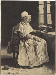Una donna che lavora a maglia