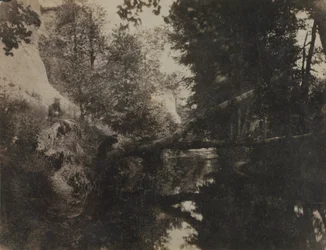 Paesaggio con figura seduta sulla riva di un ruscello