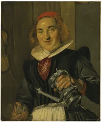 Giovane donna che tiene un bicchiere e una caraffa