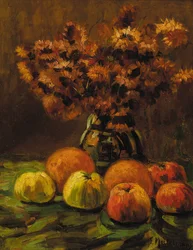 Mele, arance e un vaso di fiori su un tavolo