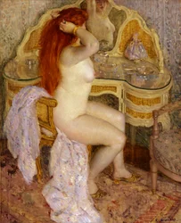 Nudo seduto al suo tavolo da toeletta