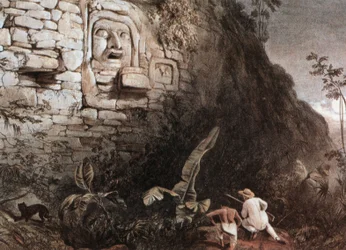 Cacciatore e la sua guida davanti alla testa maya di Itzam Na
