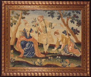 Un quadro ricamato di una donna in un parco con una gabbia per uccelli