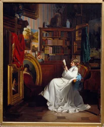 Ragazza che legge un libro in un ufficio